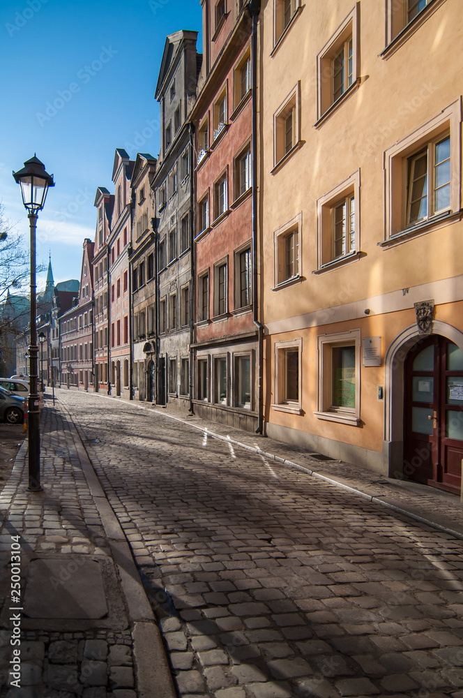 Charming street in Wroclaw, tenement houses, a lighthouse, an alley, Wroclaw, Poland