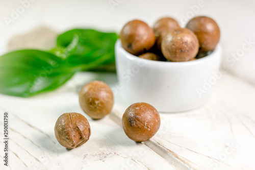 Nice macadamia nuts on whit...