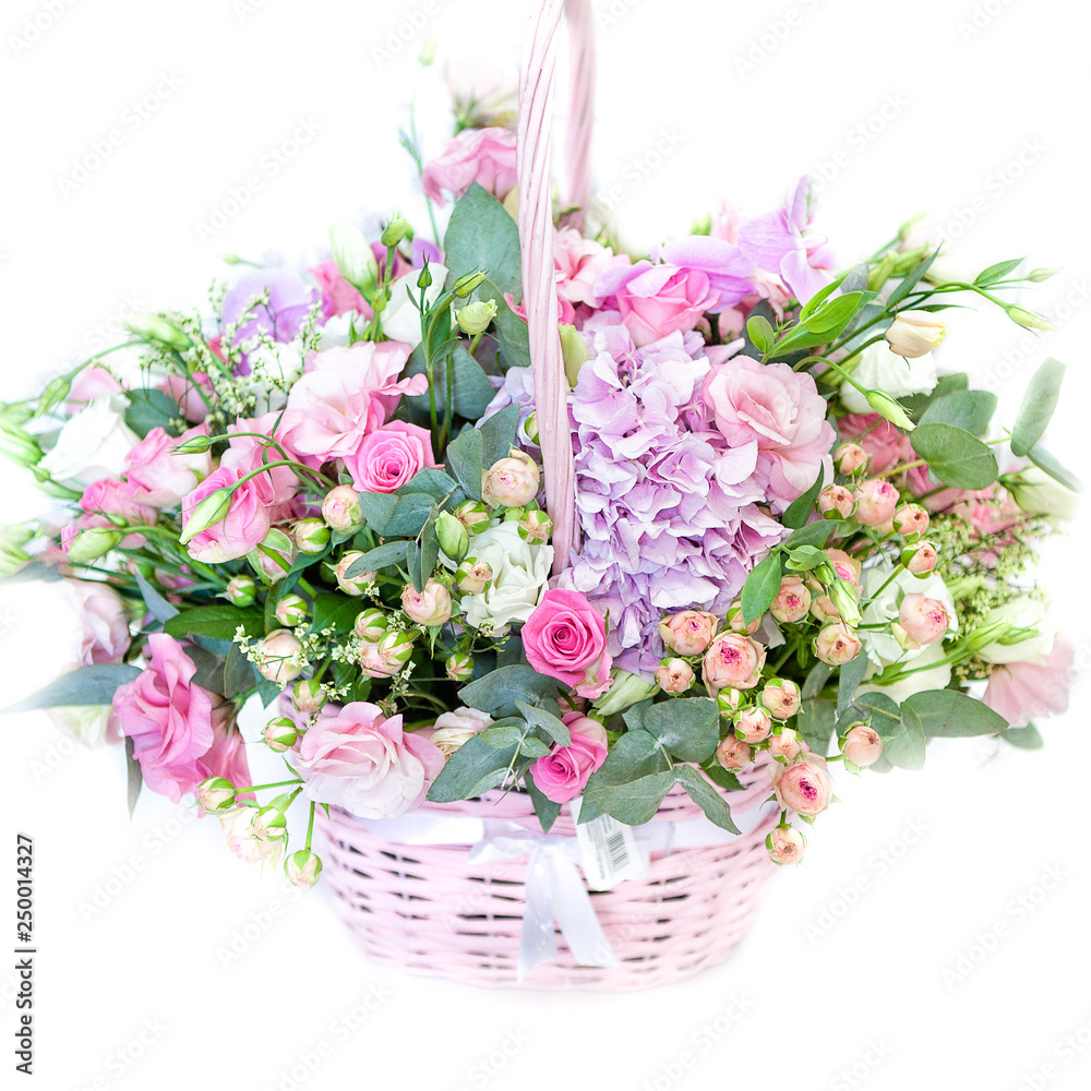 bouquet of flowers in basket isolated on white