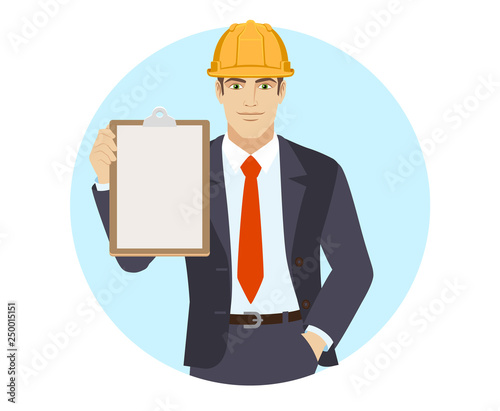 Businessman in construction helmet holding the clipboard