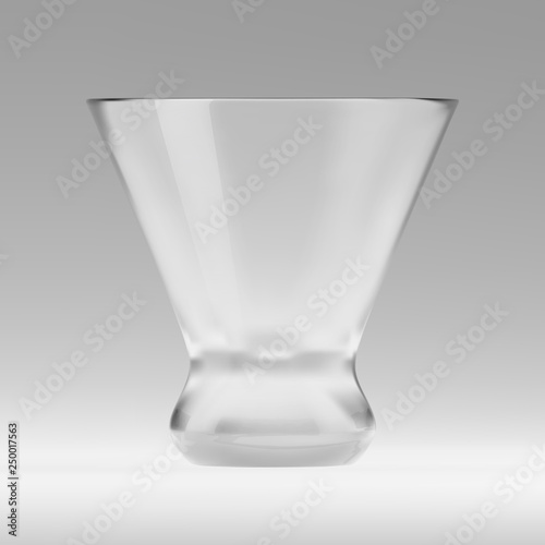 Empty transparent triangular glass for cosmopolitan cocktail