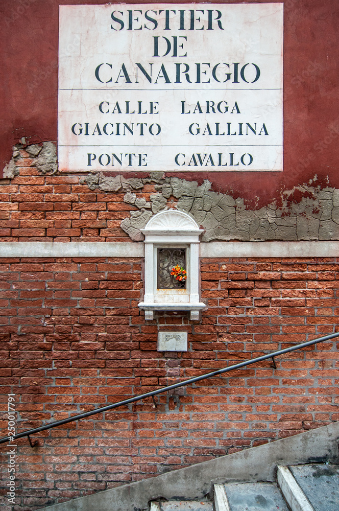 Traditional road sign near Ponte Cavallo in Venice