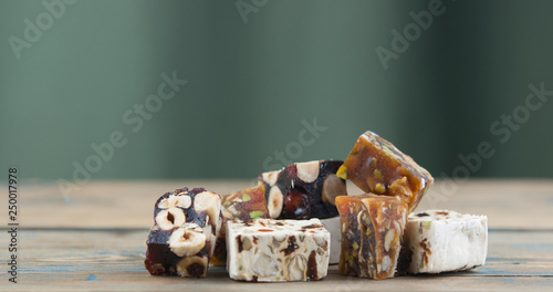 Photography Turkish delight on a dark wood background
