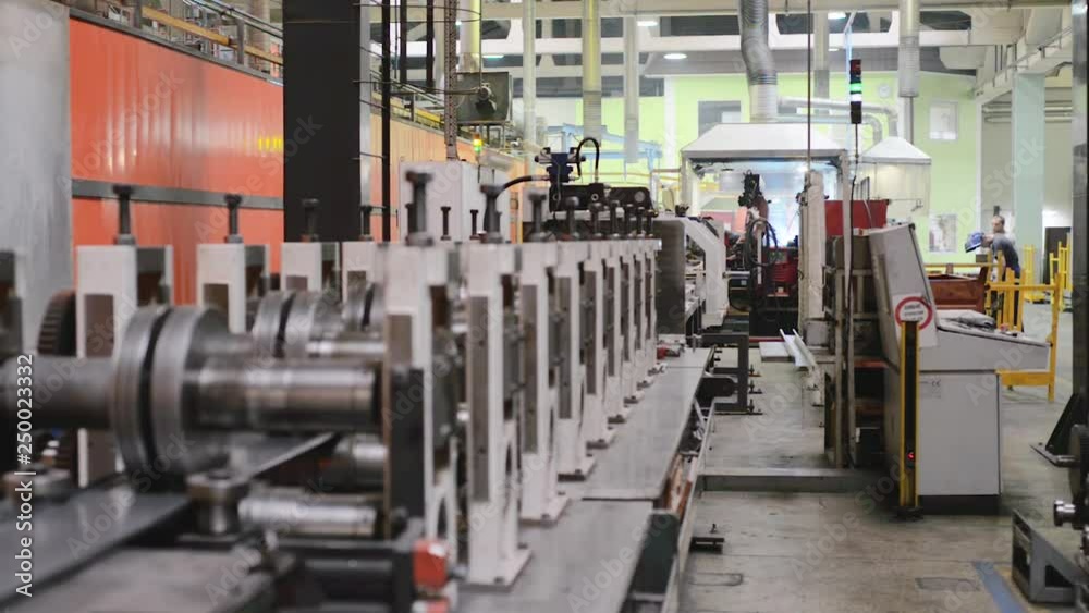 Roller forming machine. The interior of the plant producing a metal profile. Roller forming machine. The interior of the plant producing a metal profile.
