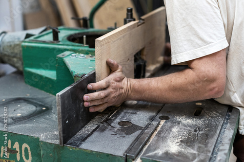 Design wood concept. Cropped photo of cabinetmaker handyman trad