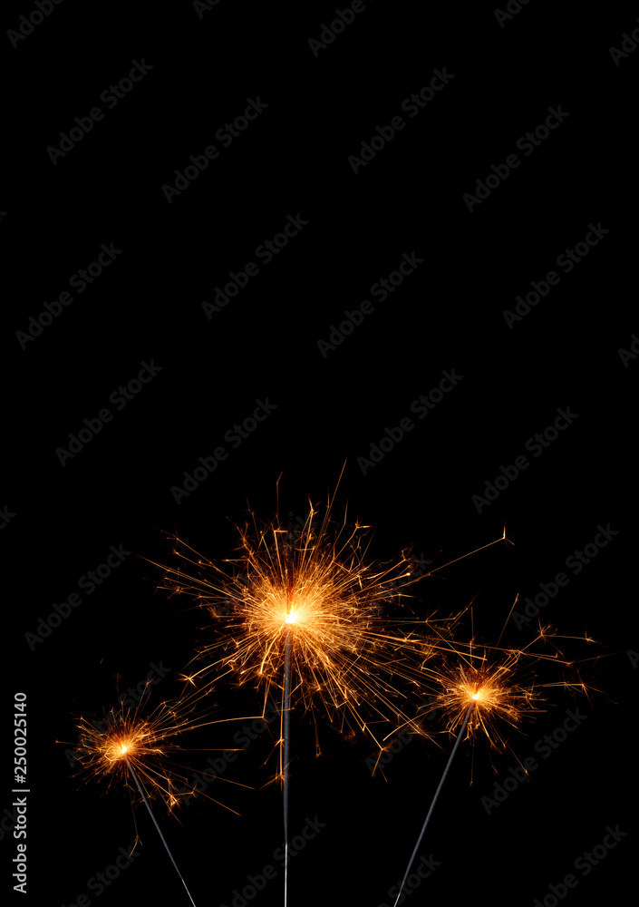 Party sparklers isolated on black background