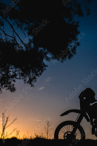 Fototapeta Naklejka Na Ścianę i Meble -  motorcycle silhoette enduro off road adventure sunset sunrise