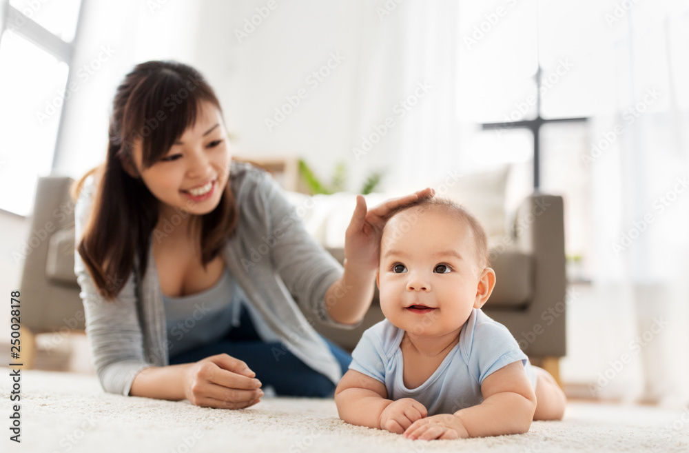 babyhood, childhood and people concept - sweet little asian baby boy and mother at home babyhood, childhood and people concept - sweet little asian baby boy and mother at home