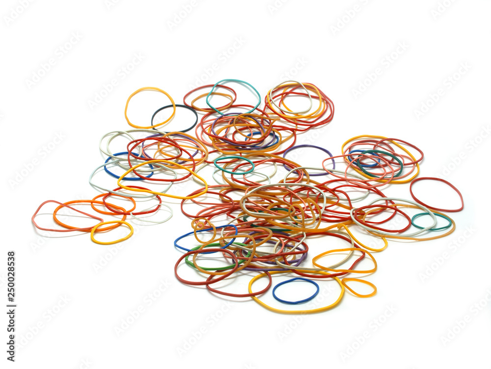 Rubber bands randomly scattered on a white surface Rubber bands randomly scattered on a white surface