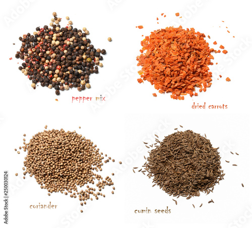 Four kinds of dried spices. A mixture of peppers, dried carrots, coriander, cumin seeds. White isolated background. View from above.