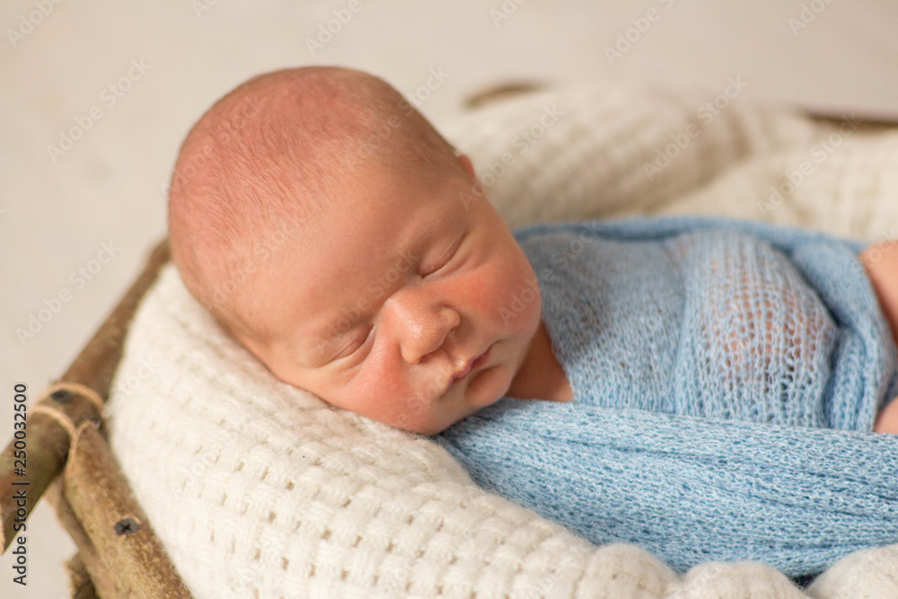 newborn baby. the first photo shoot of a newborn. the baby in the basket. wooden basket newborn baby. the first photo shoot of a newborn. the baby in the basket. wooden basket