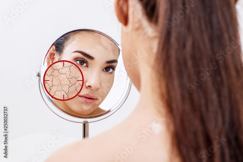 Red aim shows dry facial skin before moistening.
