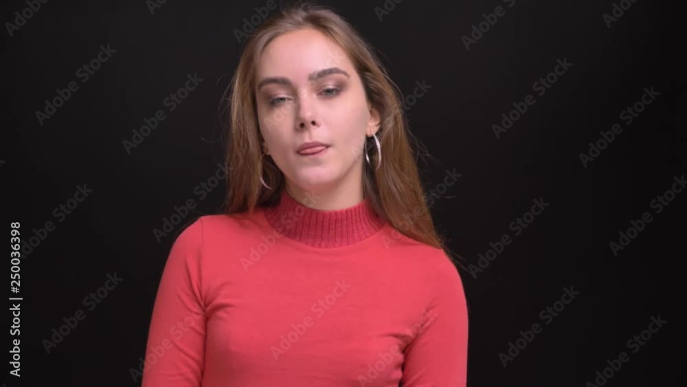 Closeup portrait of young beautiful caucasian female being bored and awaiting for someone Closeup portrait of young beautiful caucasian female being bored and awaiting for someone