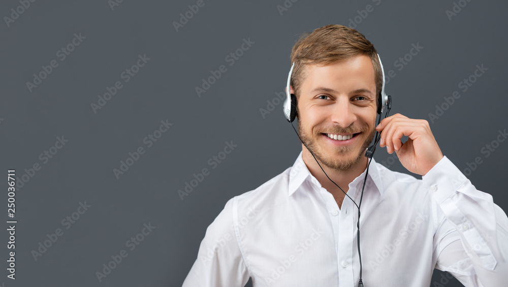 Call center employee isolated on a gray background. Call center employee isolated on a gray background.
