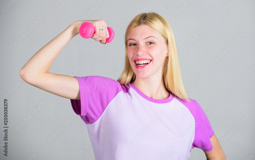Woman adorable blonde exercising with dumbbell. Easy exercises with dumbbell. Workout with dumbbell. Biceps exercises for female. Girl hold dumbbell. Fitness instructor. Healthy lifestyle concept Woman adorable blonde exercising with dumbbell. Easy exercises with dumbbell. Workout with dumbbell. Biceps exercises for female. Girl hold dumbbell. Fitness instructor. Healthy lifestyle concept