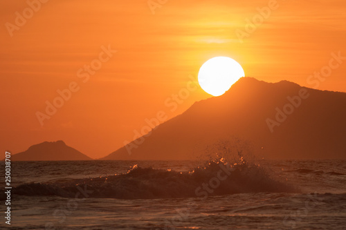 beautiful sunset on the reserve beach (praia da reserva), recreio dos bandeirantes, rio de janeiro - brazil photo