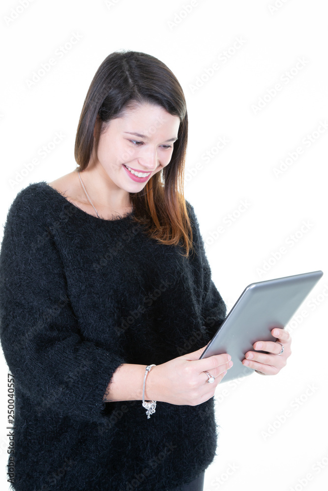 Attractive smiling girl using tablet young Woman with digital pad pc isolated on white background Attractive smiling girl using tablet young Woman with digital pad pc isolated on white background