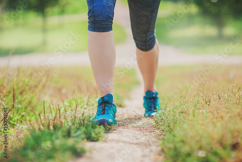 Young fitness woman legs running. Healthy lifestyle