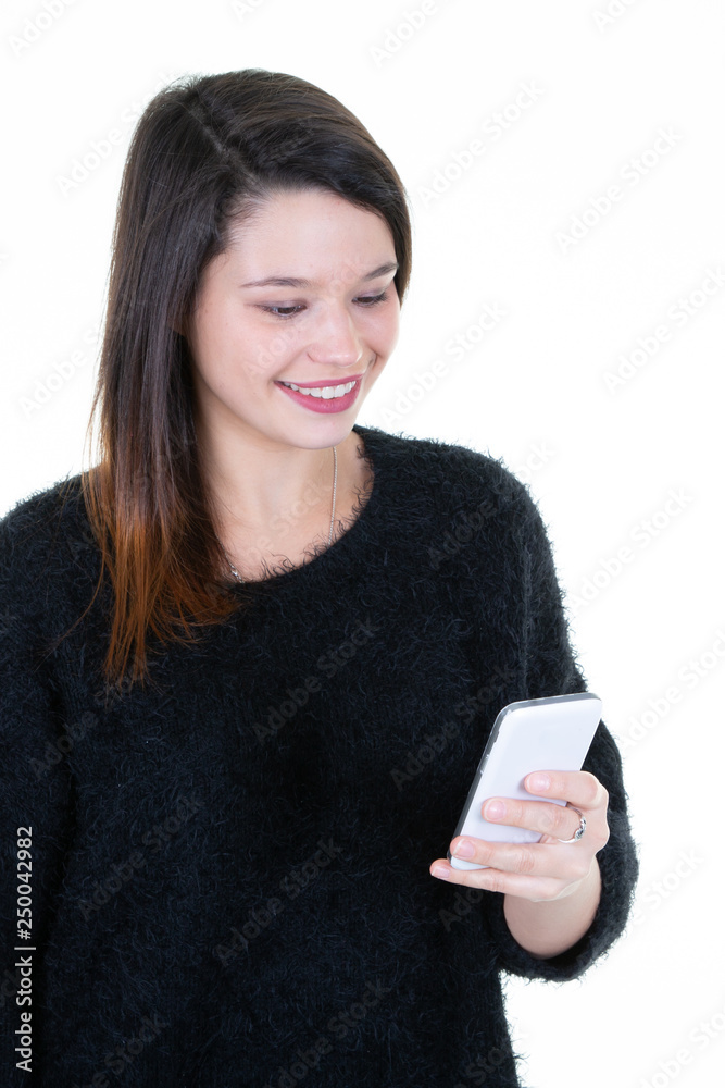 Portrait of a cheerful young girl texting in phone smartphone Portrait of a cheerful young girl texting in phone smartphone