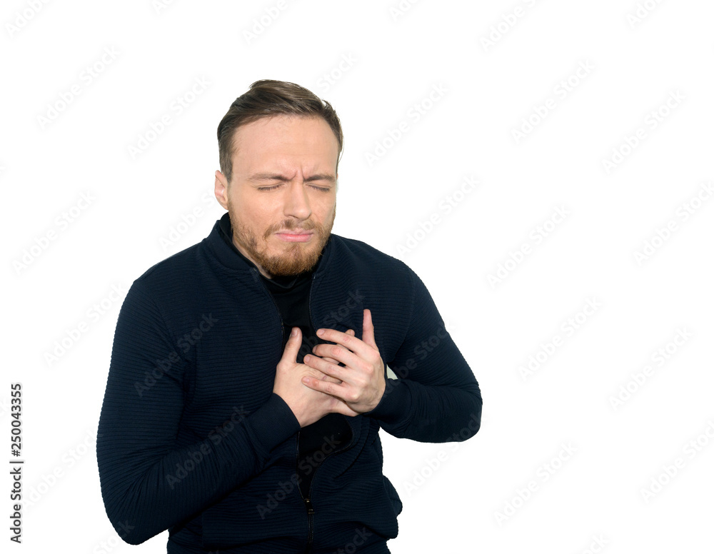 Young caucasian man having heart aches. Isolated on white background. Heartache concept.