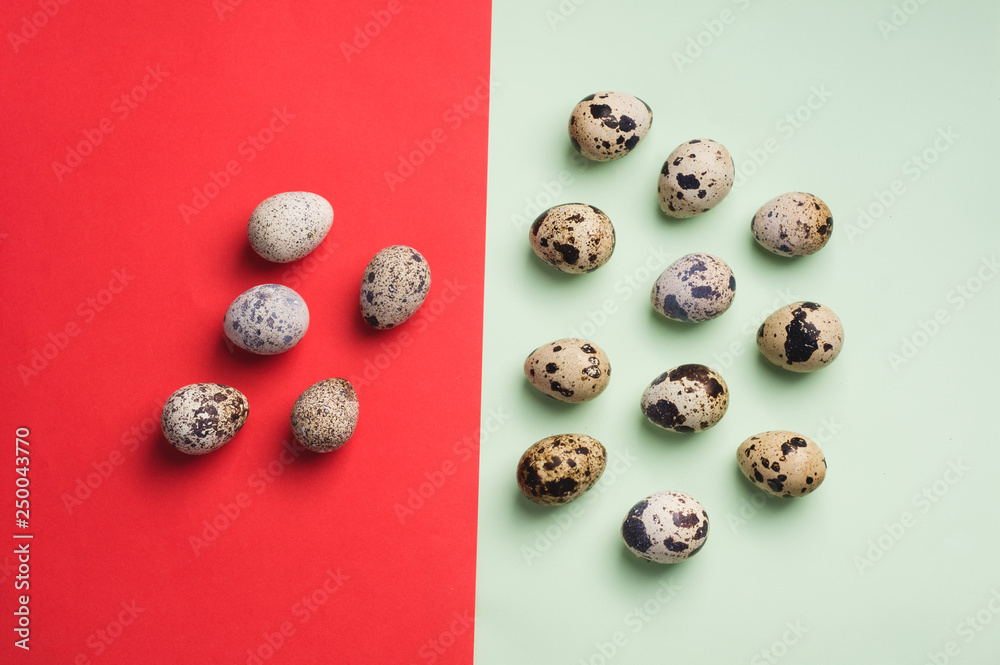 heap of quail eggs on green and red background. Vegetarian food concept. Eco products Top view. flatlay heap of quail eggs on green and red background. Vegetarian food concept. Eco products Top view. flatlay