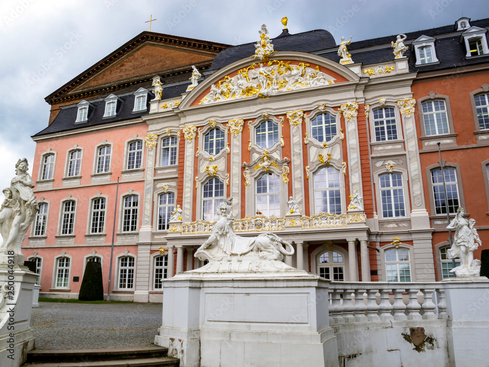 Statues of a Sphinx, Apollo and Flora by Ferdinand Tietz in front of the Electoral Palace and the Aula Palatina in Trier, Germany