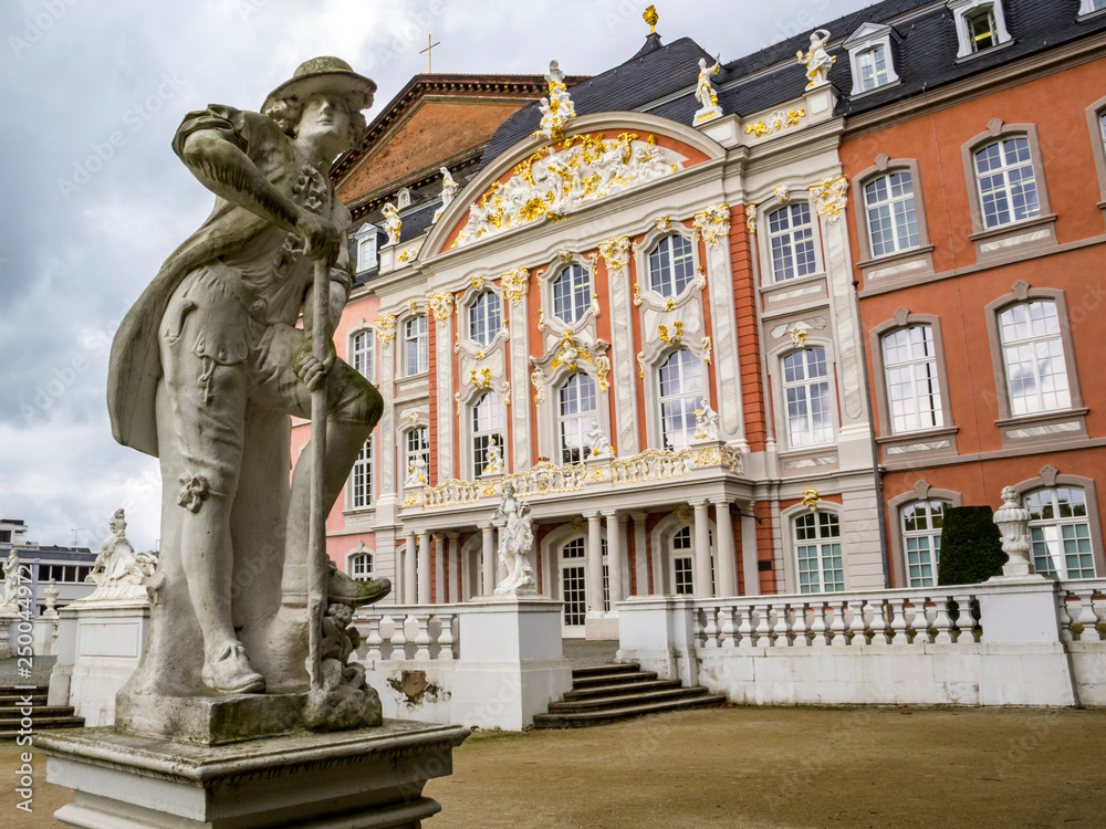 The Gardener - a statue by Ferdinand Tietz in front of the Electoral Palace and the Aula Palatina in Trier, Germany