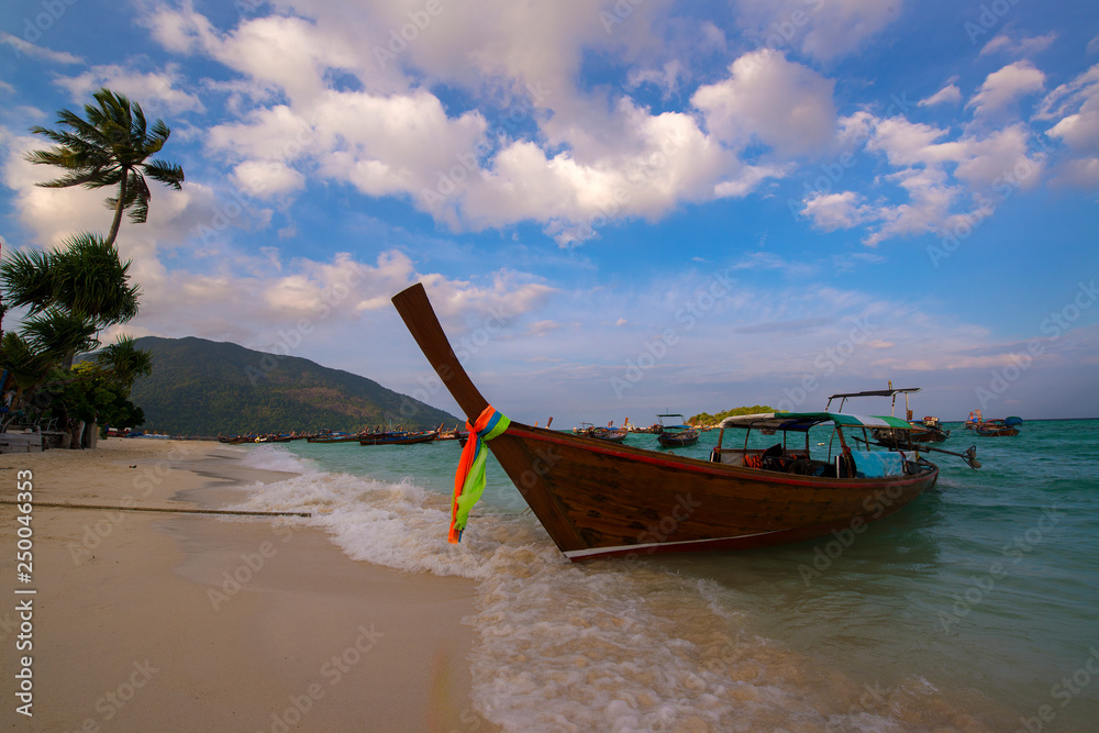 fishing boat is parked on the shore of the beach fishing boat is parked on the shore of the beach