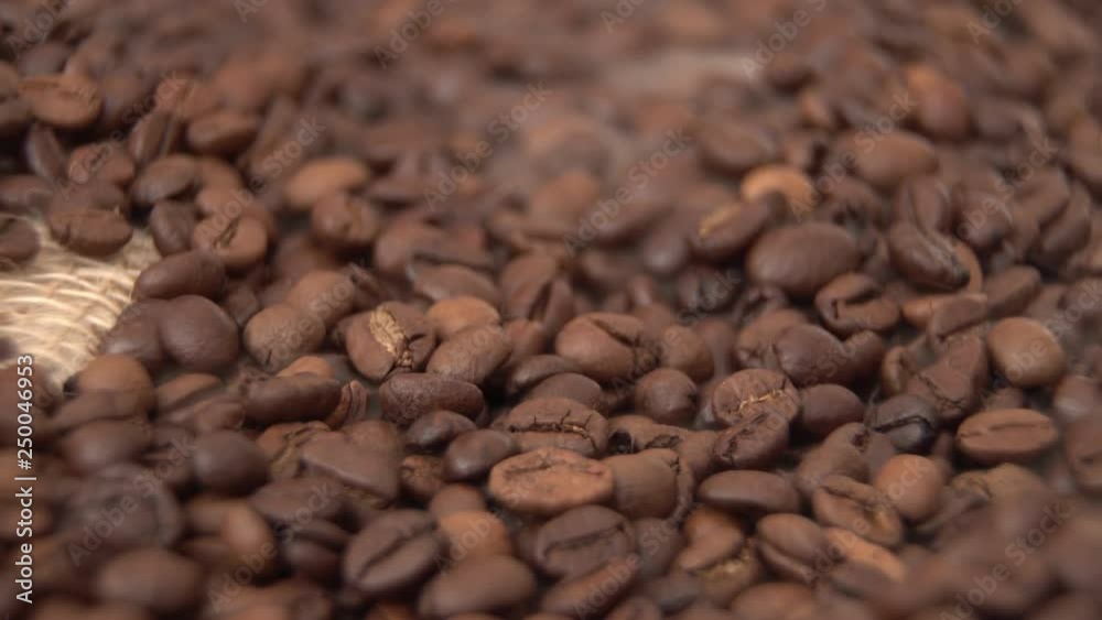 male hand blows away the haze with a grain of coffee, close-up. male hand blows away the haze with a grain of coffee, close-up.