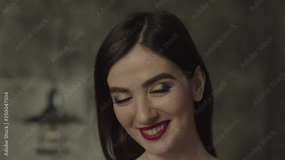 Naturally beautiful brunette woman in evening makeup looking happily at camera with beaming radiant smile. Portrait of stunning pleased female demonstrating natural beauty, being positive and joyful. Naturally beautiful brunette woman in evening makeup looking happily at camera with beaming radiant smile. Portrait of stunning pleased female demonstrating natural beauty, being positive and joyful.