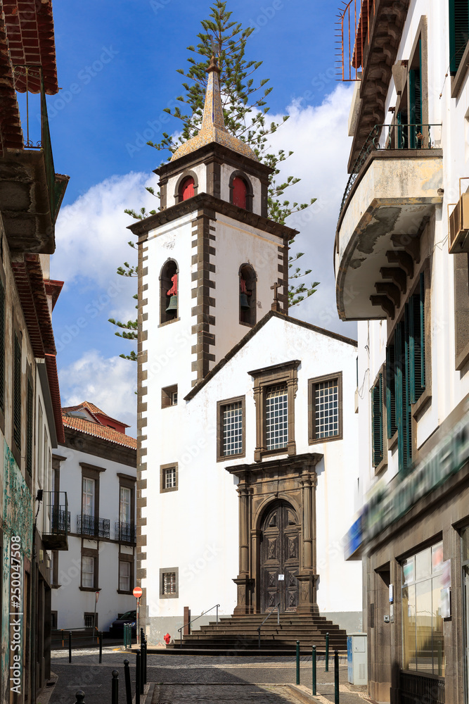 Beautiful vibrant cityscape in the streets of Funchal, Madeira, with the Parish of Sao Pedro on a summer day