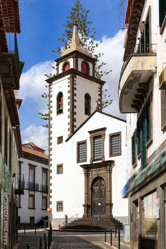 Beautiful vibrant cityscape in the streets of Funchal, Madeira, with the Parish of Sao Pedro on a summer day © dennisvdwater
