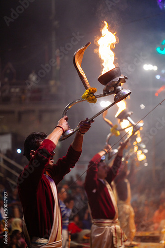 VARANASI, INDIA- 23 JANUARY 2017 : A Hindu priest performs the Ganga Aarti ritual in Varanasi
