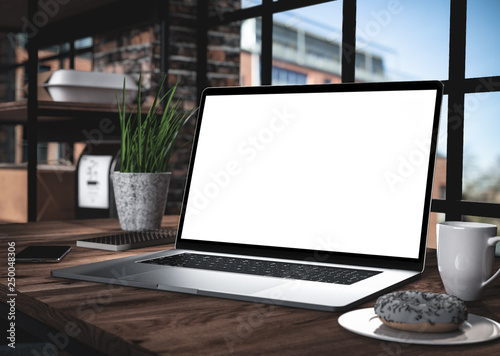 Laptop with blank screen on table in office loft interior building - mockup, template 