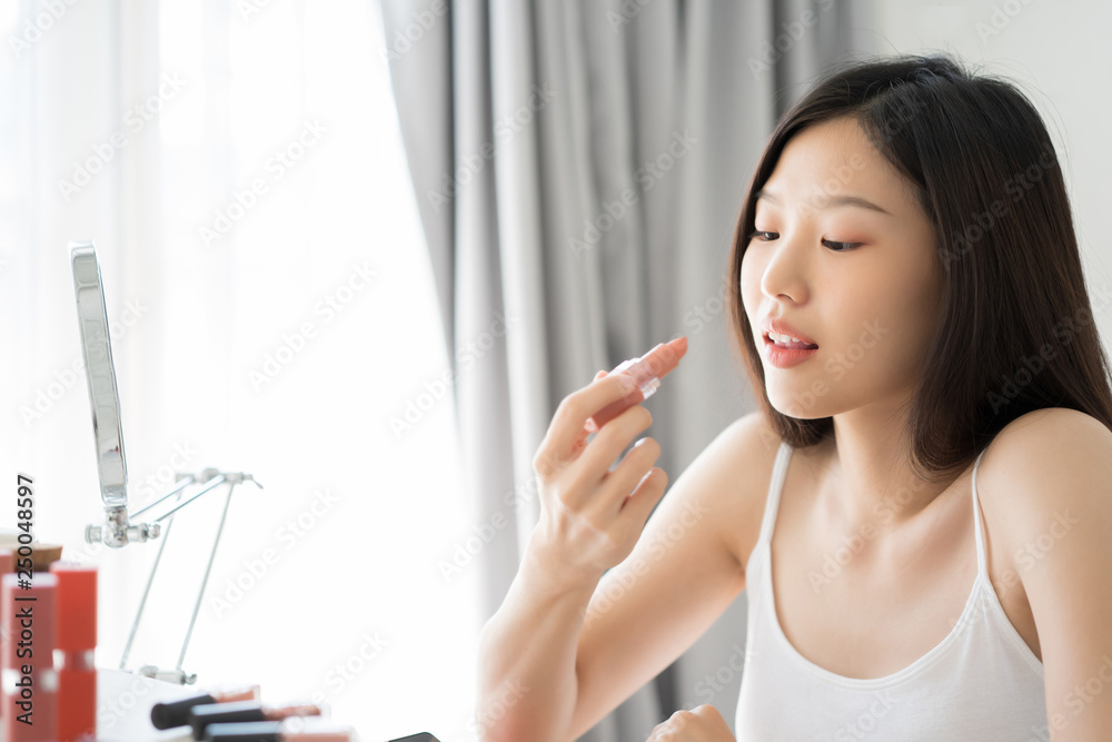 Young Asian female makeup beauty by lipstick Young Asian female makeup beauty by lipstick