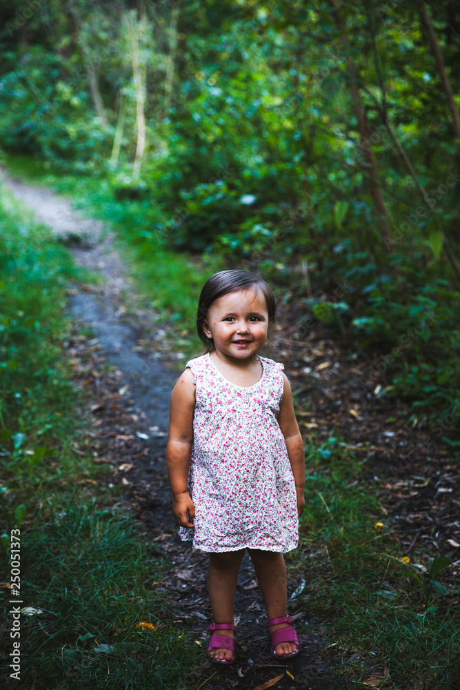 Little girl walking in the park Little girl walking in the park