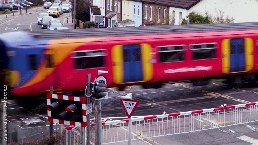 A Train passes a Level crossing in London