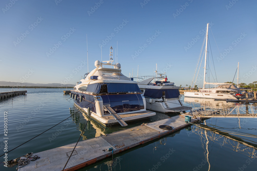 Fototapeta premium Philippines Mactan Island Yacht club marina on a blue sky day in a tranquil scene with reflections in water