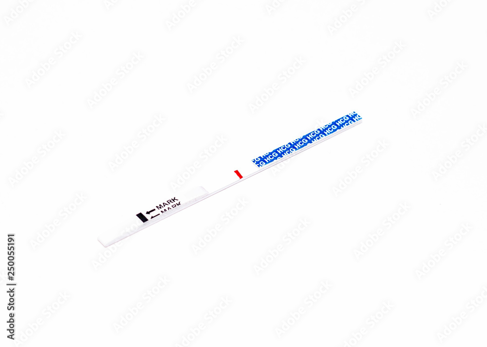Pregnancy test on a white background with one negative strip, female infertility, close-up, isolate, sterility Pregnancy test on a white background with one negative strip, female infertility, close-up, isolate, sterility