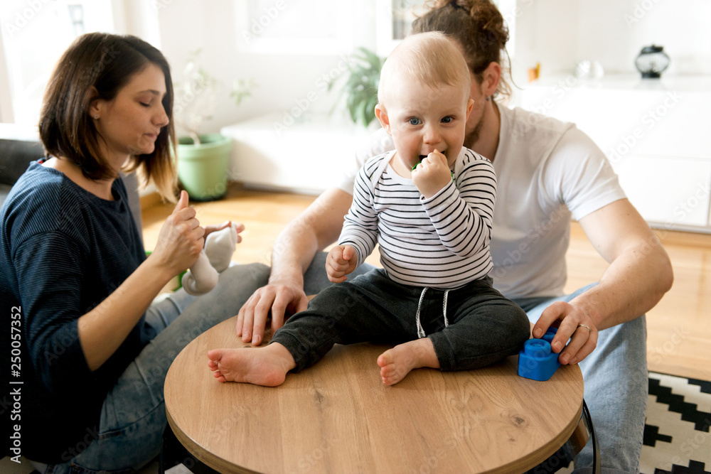 Young parents playing with baby boy Young parents playing with baby boy