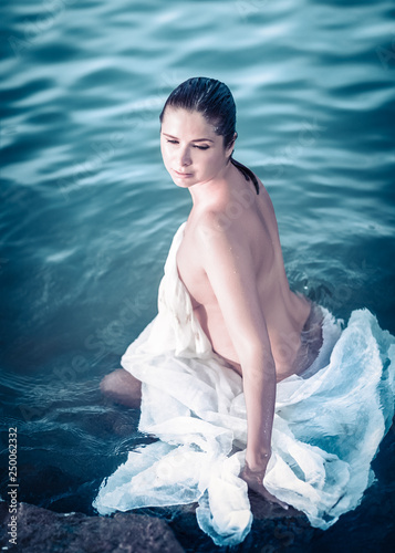 Portrait of a beautiful woman bather in a sea