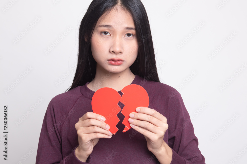 Beautiful young Asian woman with broken heart. Beautiful young Asian woman with broken heart.