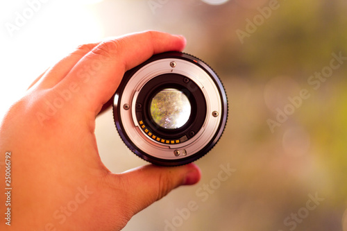 Fotografie Camera lens isolated on a blurry background