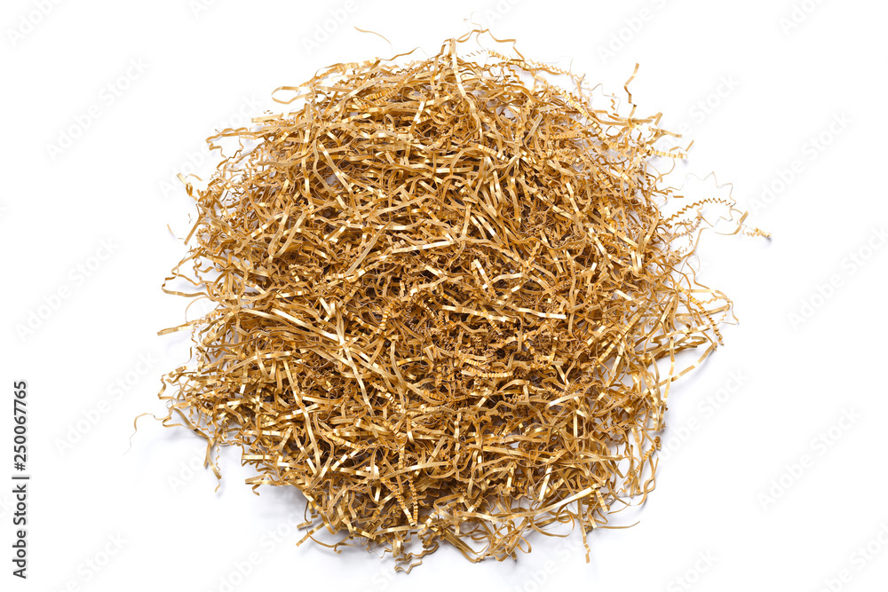 Golden shredded paper for gifting, shipping and stuffing on white background. Top view.