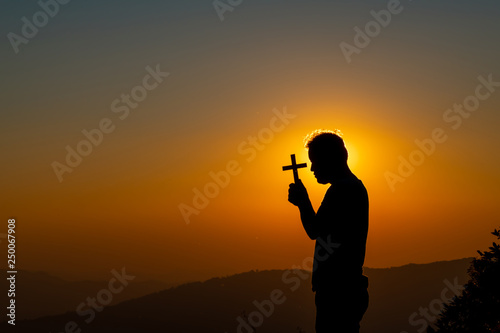 The human hand holds cross a christian religion faith concept