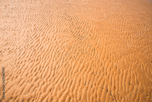 Patterns of sand by the sea.30