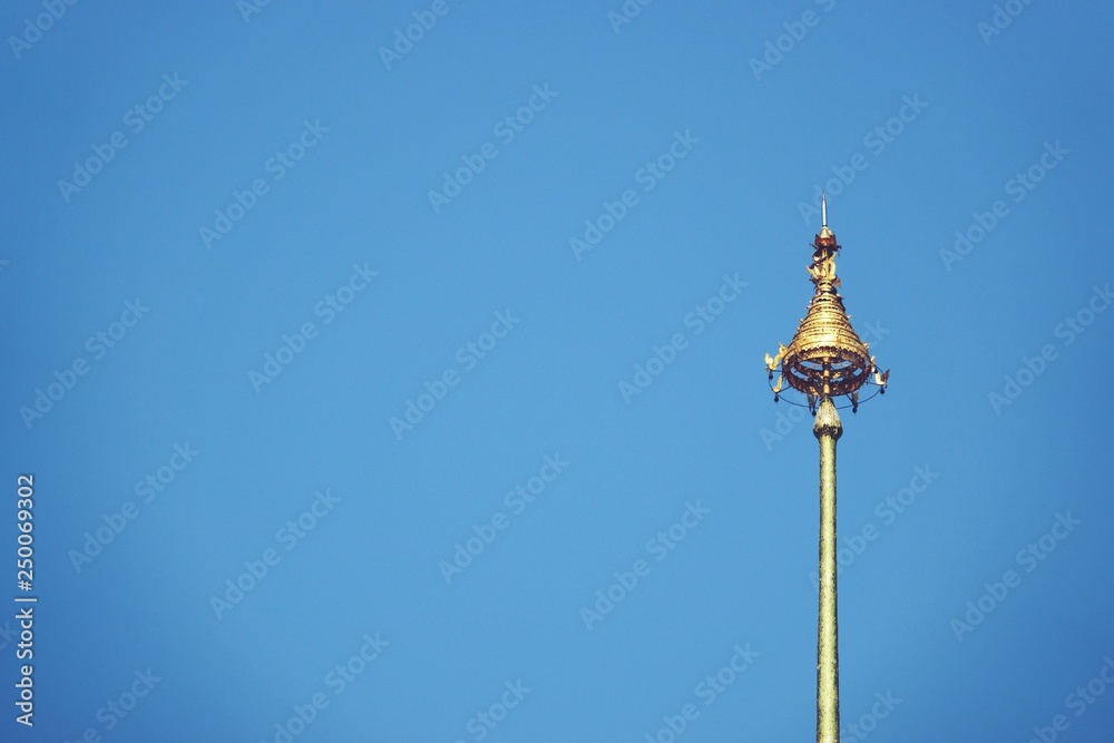 The Royal Nine-Tiered Umbrella Thailand ,Tiered umbrella with blue background, the highest point of the temple