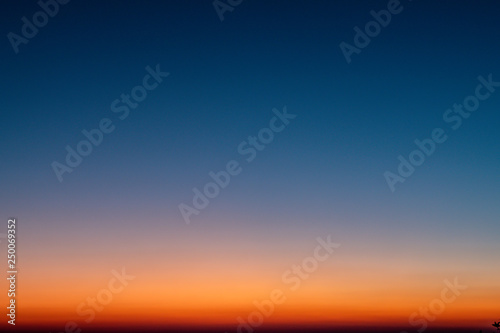 Foto Sky gradient from blue to orange sunset