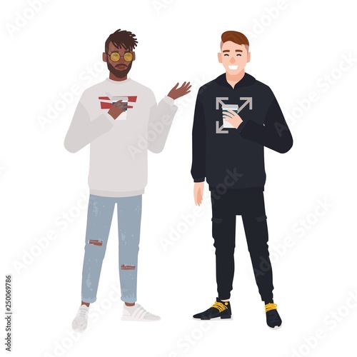 Pair of happy men dressed in casual clothes talking and drinking coffee. Dialog between friends or mates, meeting or informal conversation. Colorful vector illustration in flat cartoon style.