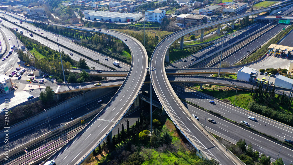 Aerial drone photo of highway multilevel junction interchange crossing road 